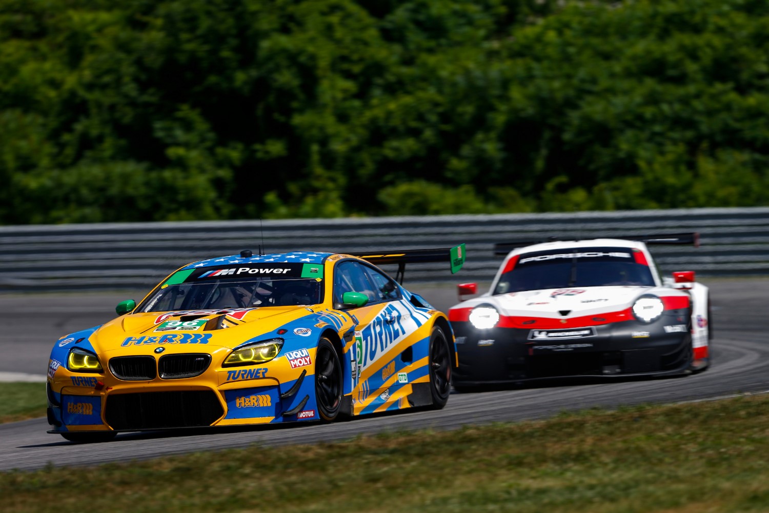 The 911 Porsche gets ready to dust the #96 Turner BMW