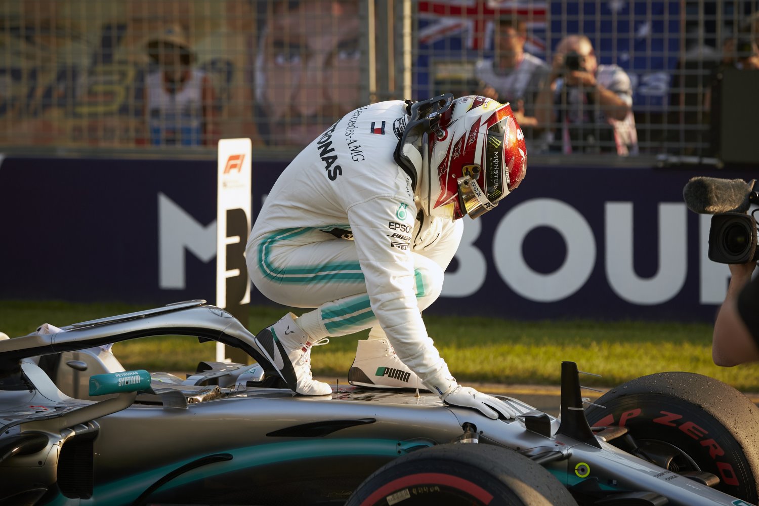 Lewis Hamilton pets his superior Mercedes