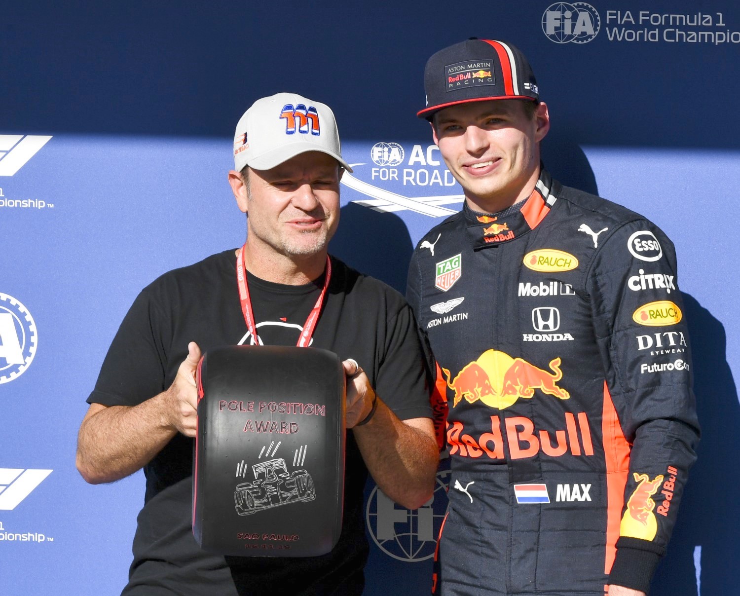 In Brazil Rubens Barrichello presented the pole award to Verstappen