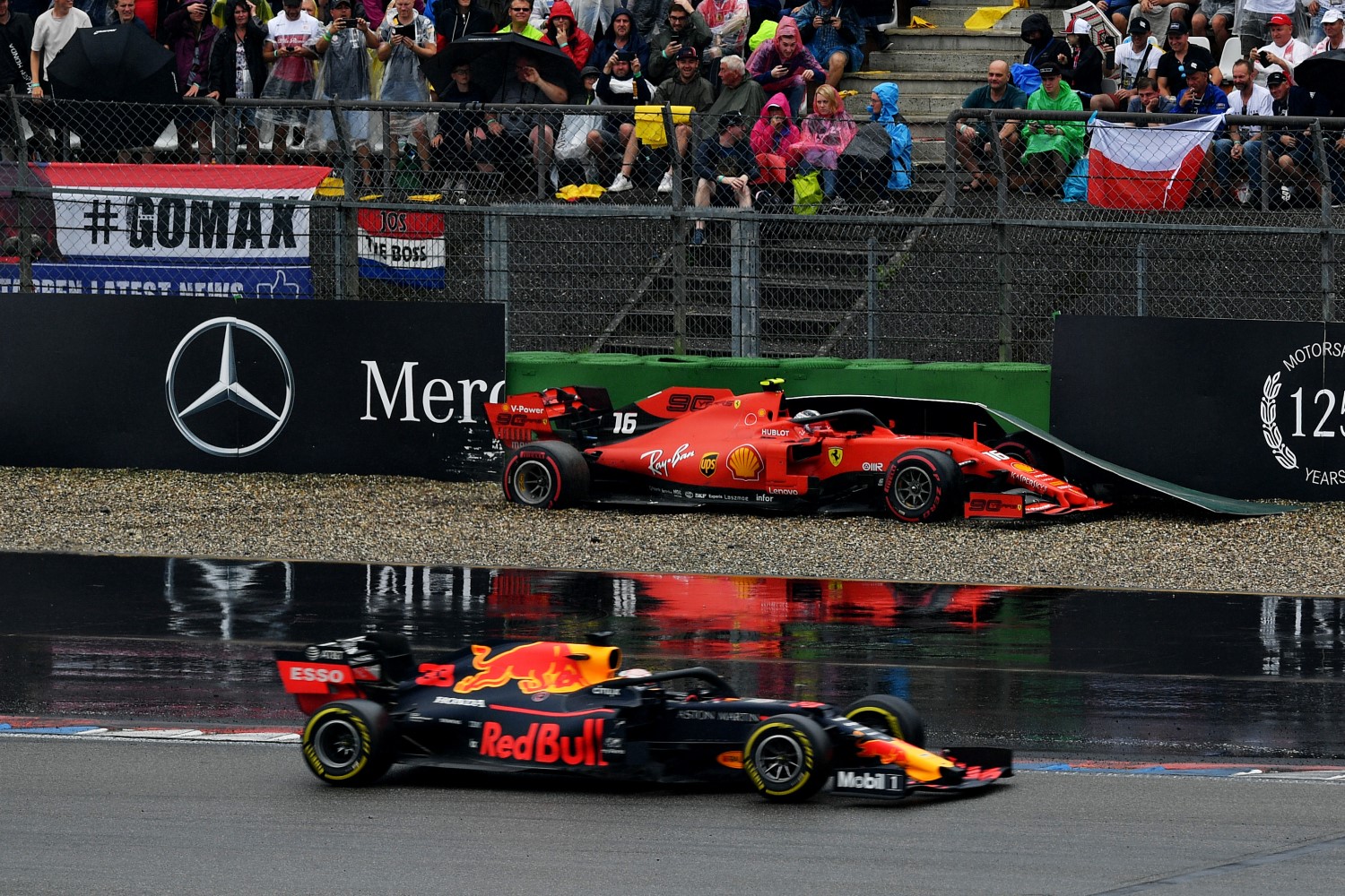 Max Verstappen leads as Charles Leclerc stuffs his car into the barriers