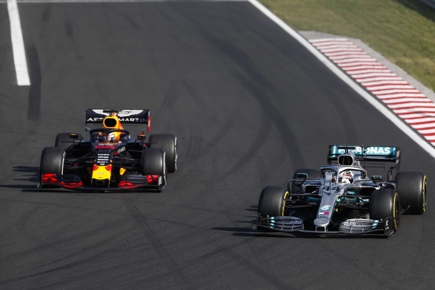Hamilton sweeps around Verstappen on the outside of Turn 1. Race over.