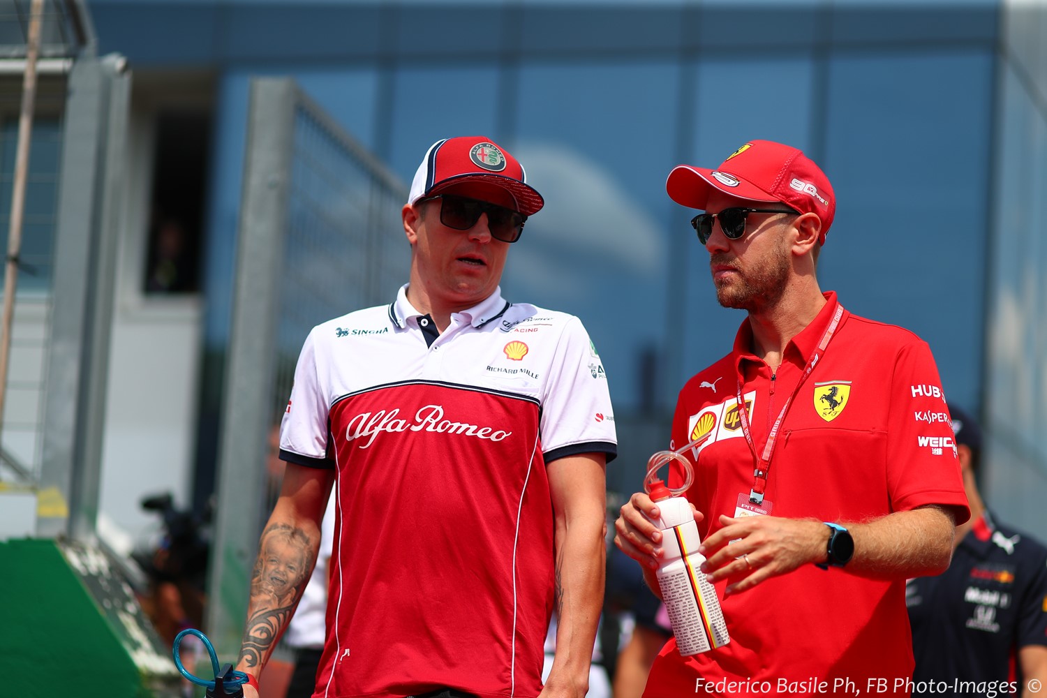 Kimi Raikkonen with former Ferrari teammate Sebastian Vettel in Hungary Sunday