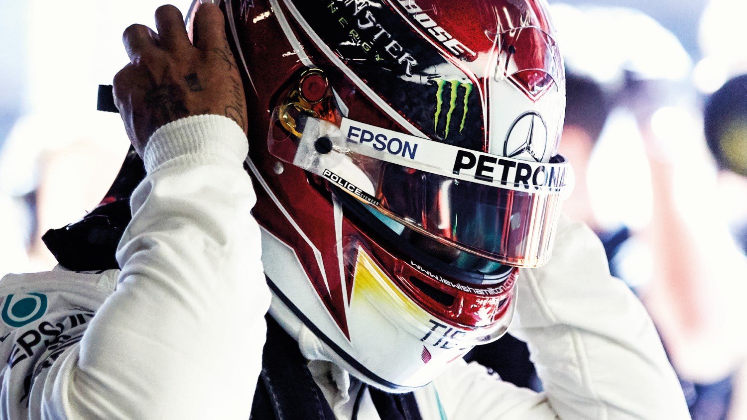 Note the minuscule logo on Hamilton's visor