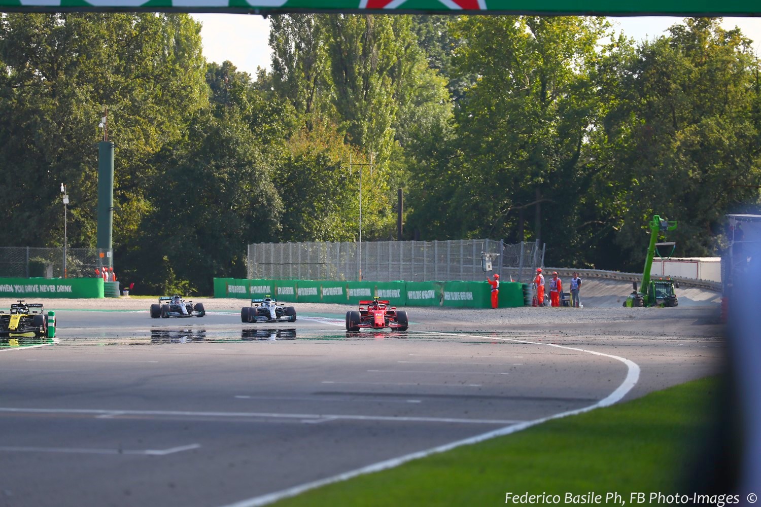 F1 cars exit the Parabolica and its expansive asphalt runoff area