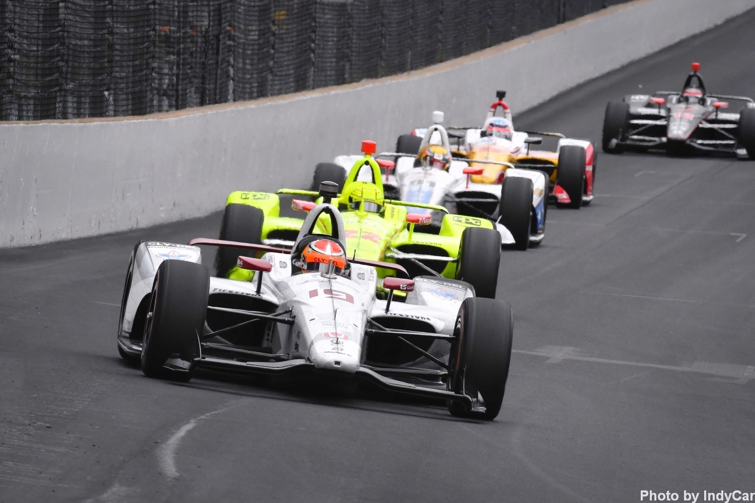 Ferrucci leads a pack of cars at Indy