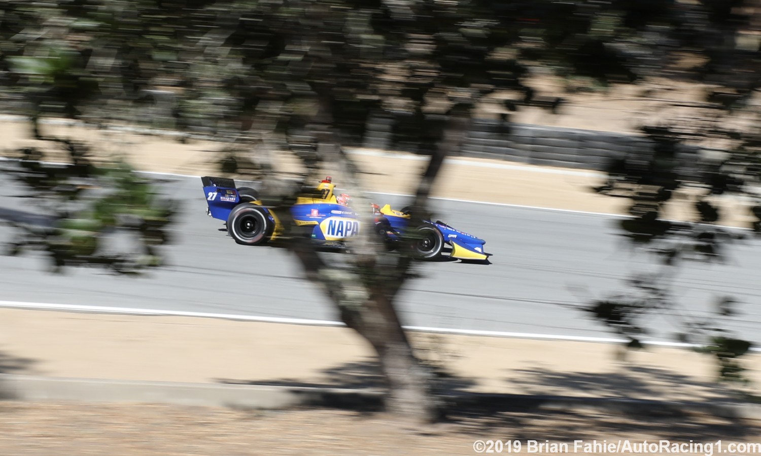 Rossi races out of the corkscrew