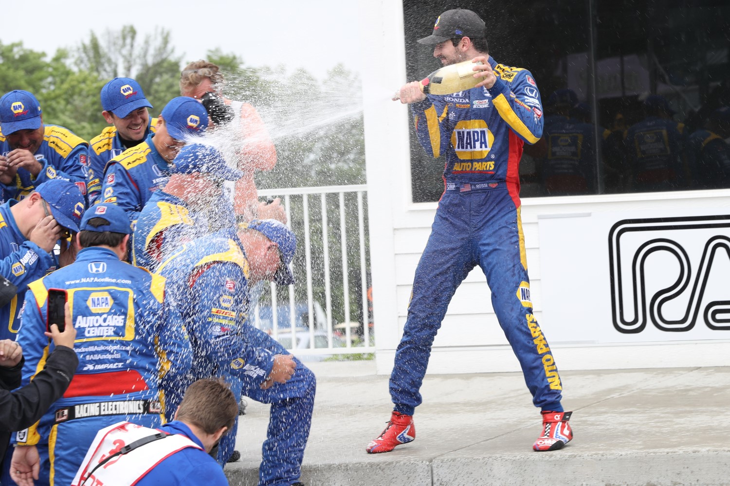 Rossi showers his crew with Champagne