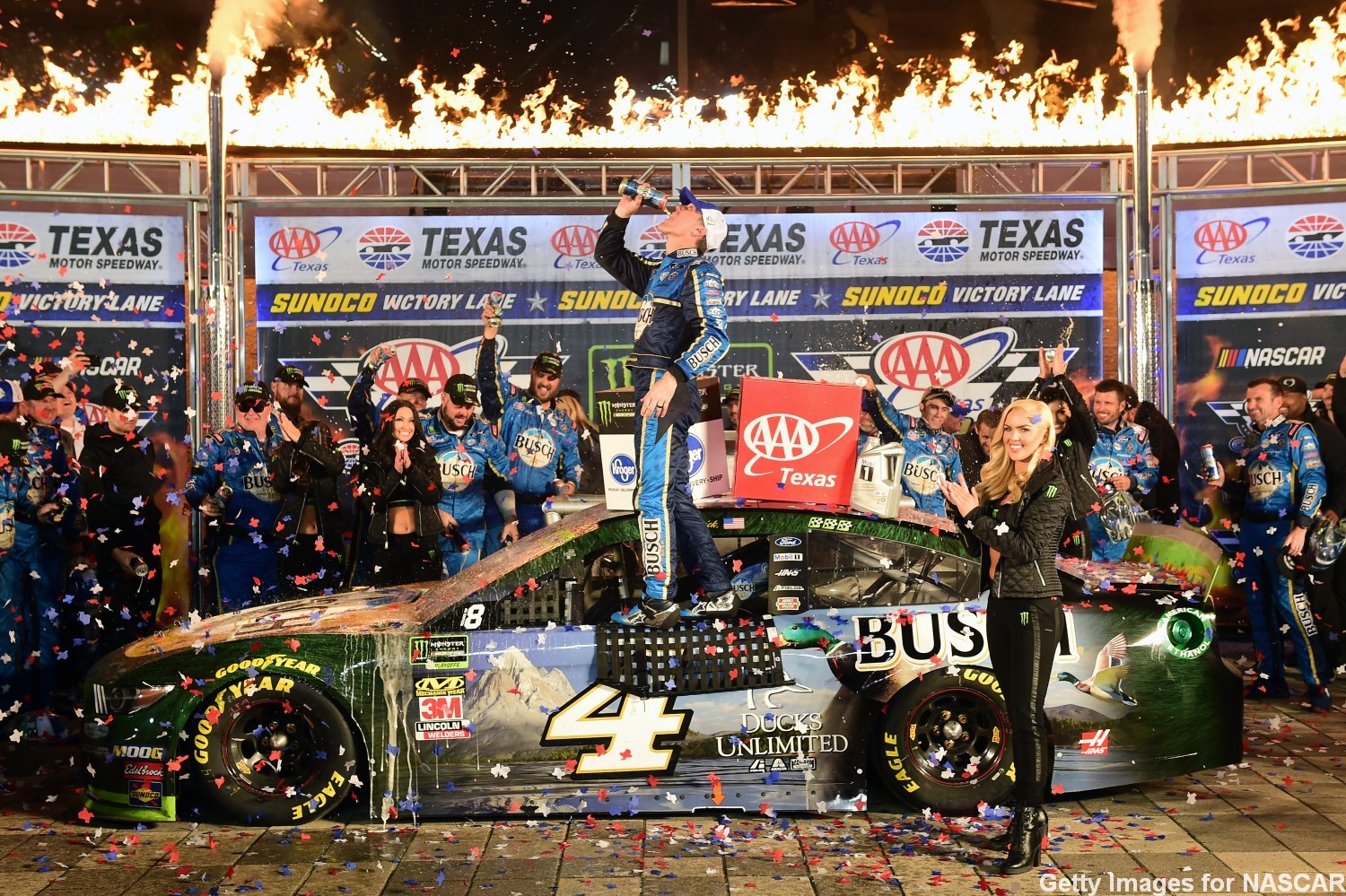 Kevin Harvick, driver of the #4 Busch Beer/Ducks Unlimited Ford, celebrates in Victory Lane after winning the Monster Energy NASCAR Cup Series AAA Texas 500 