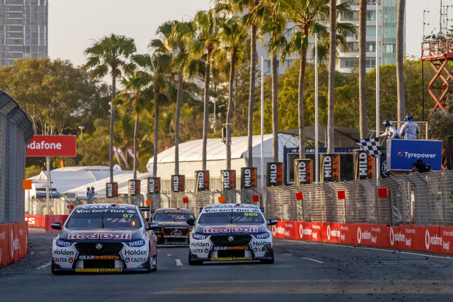 van Gisbergen leads the sister Red Bull Holden of Lowndes across the line in a close finish