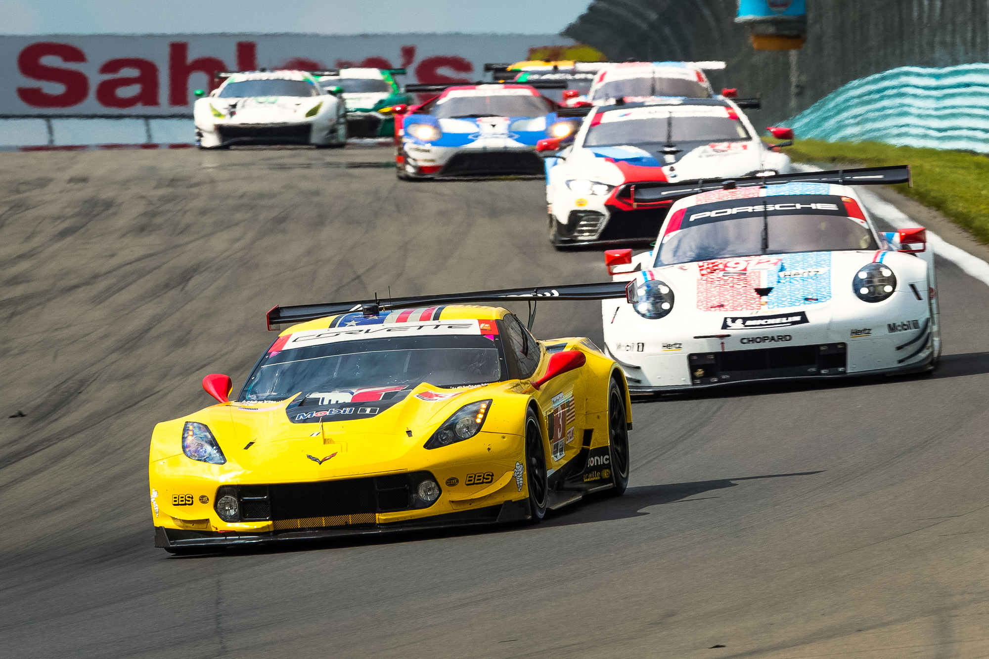 The #3 Corvette battles the Porsche