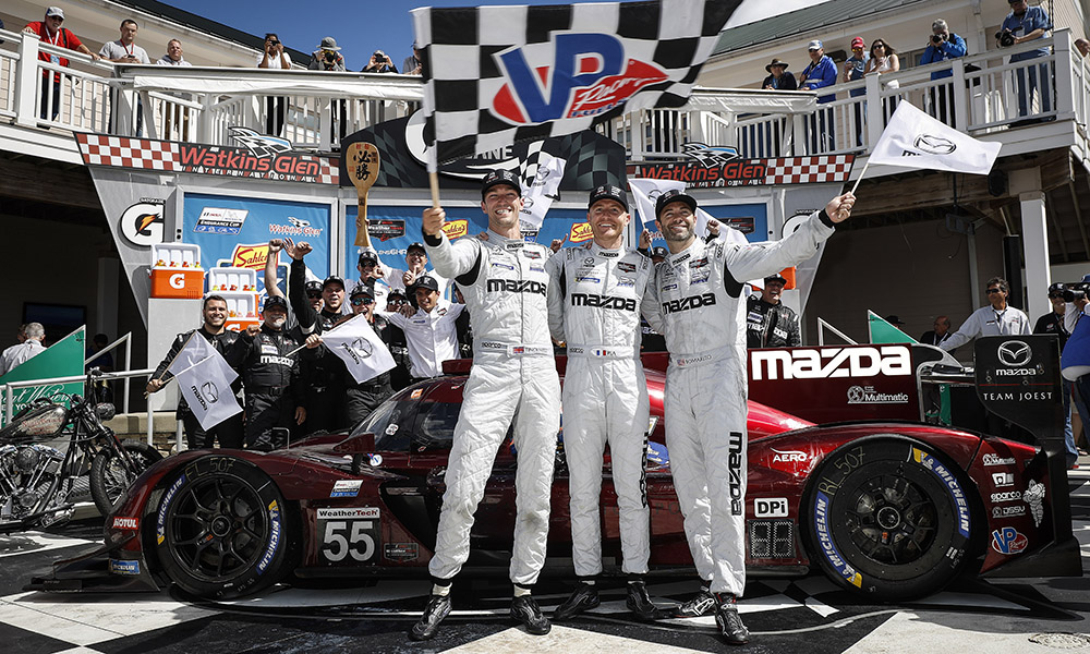 Tincknell (L) celebrates winning at Watkins Glen last year with teammates Pla and Bomarito