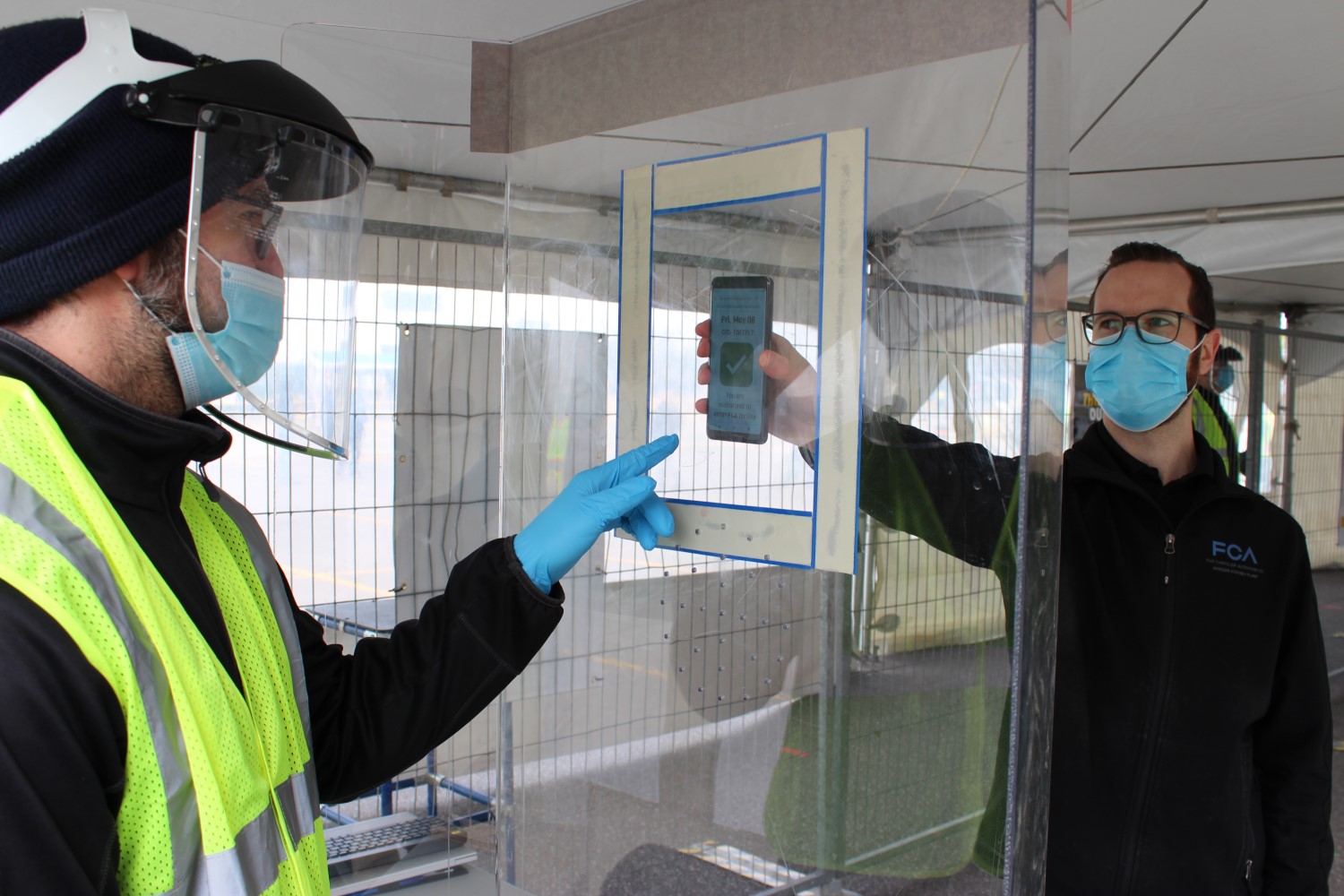 An employee at FCA’s Windsor (Ont.) Assembly Plant has his daily health screening checked via a mobile app before being allowed entry into the plant. All employees at all FCA North American locations will be required to take their temperature daily and complete a self-screening questionnaire.