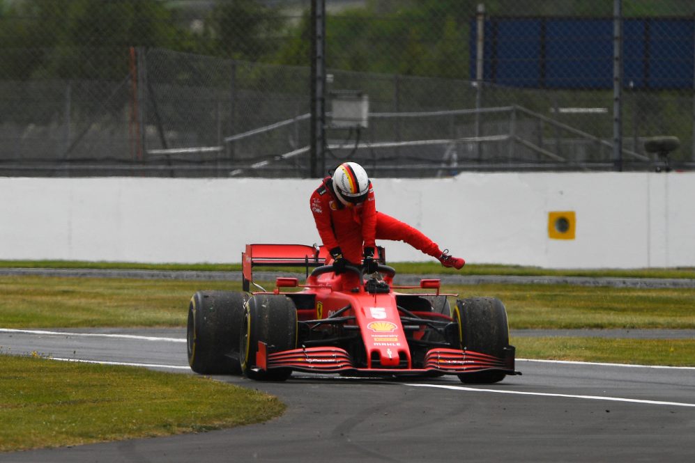 Vettel climbs from Stricken Ferrari