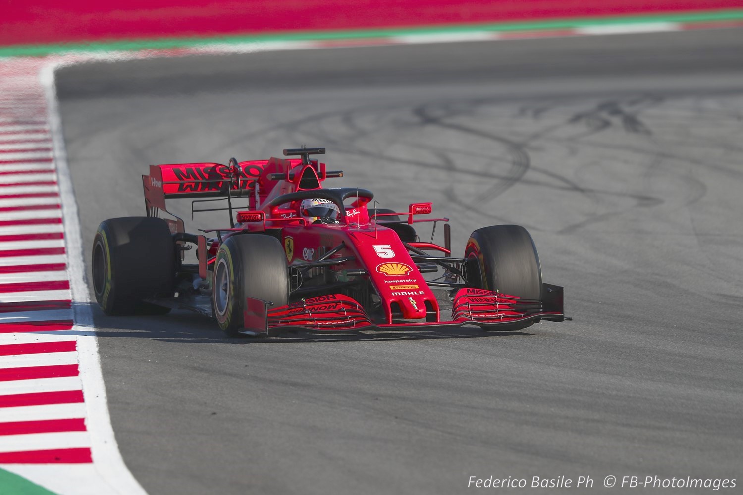Vettel in the simplistic (compared to the Mercedes) and so far slow Ferrari