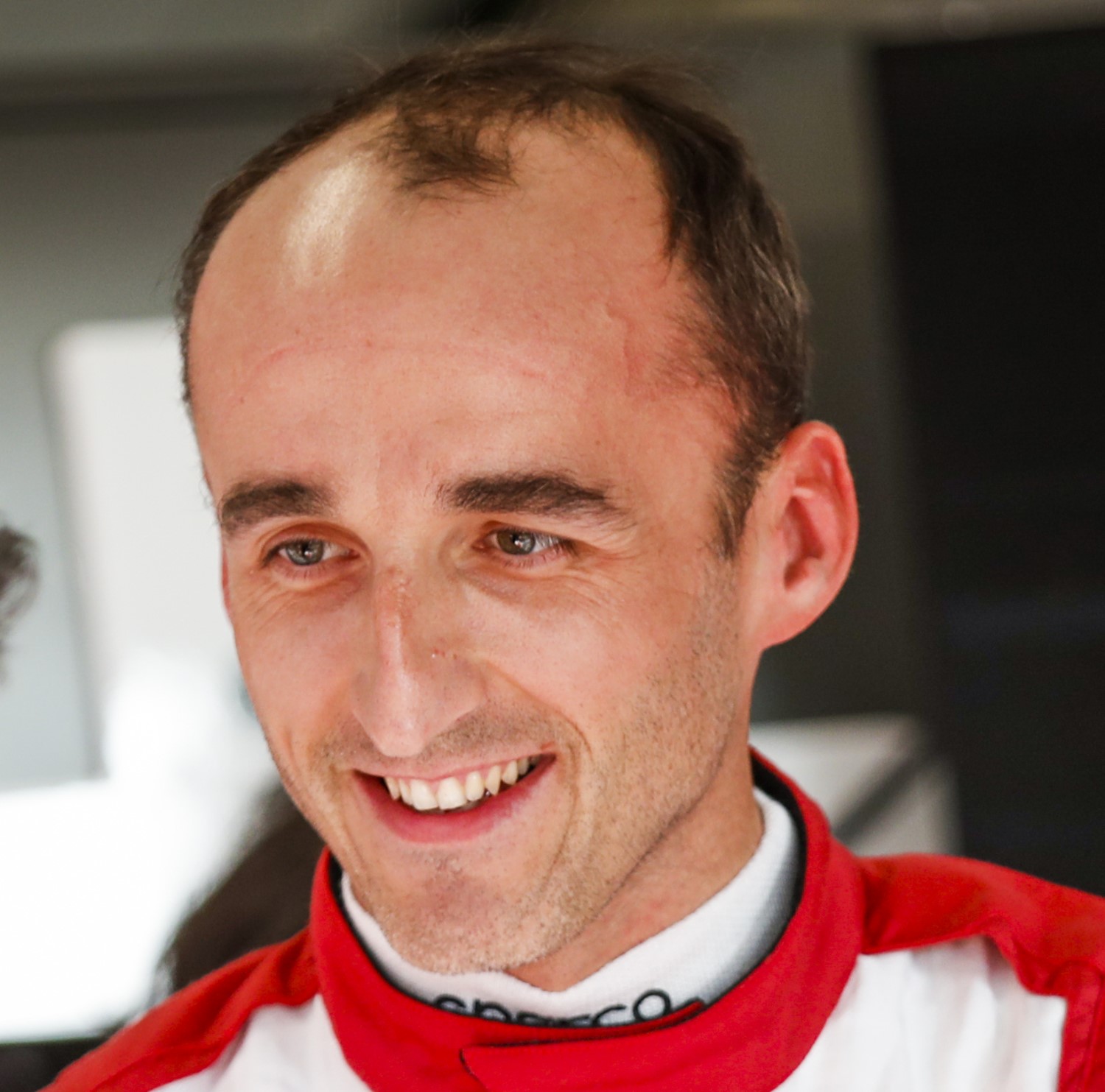 Robert Kubica beaming at Alfa Romeo