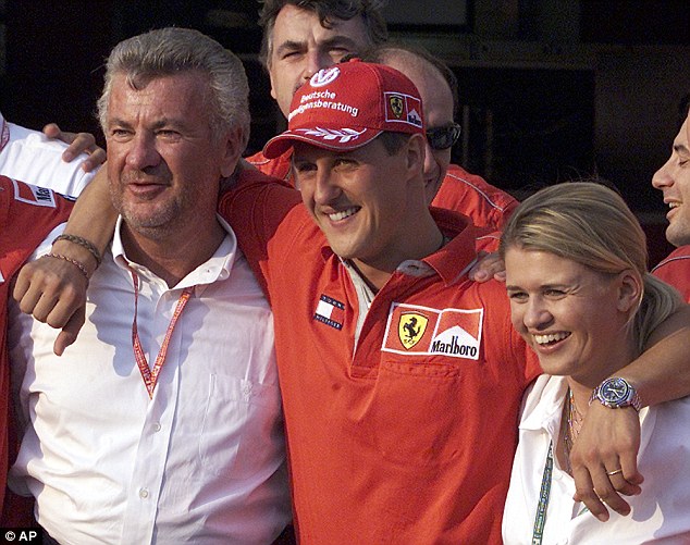 Back in their Ferrari days, Weber with Schumacher and his wife