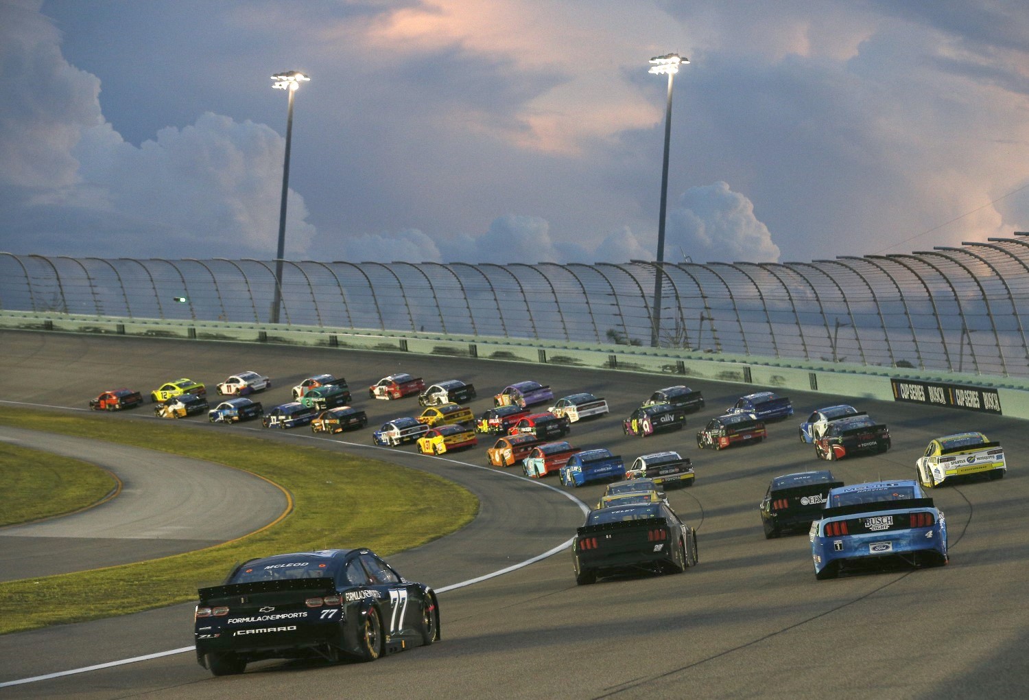 Chase Elliott leads as storm clouds threaten