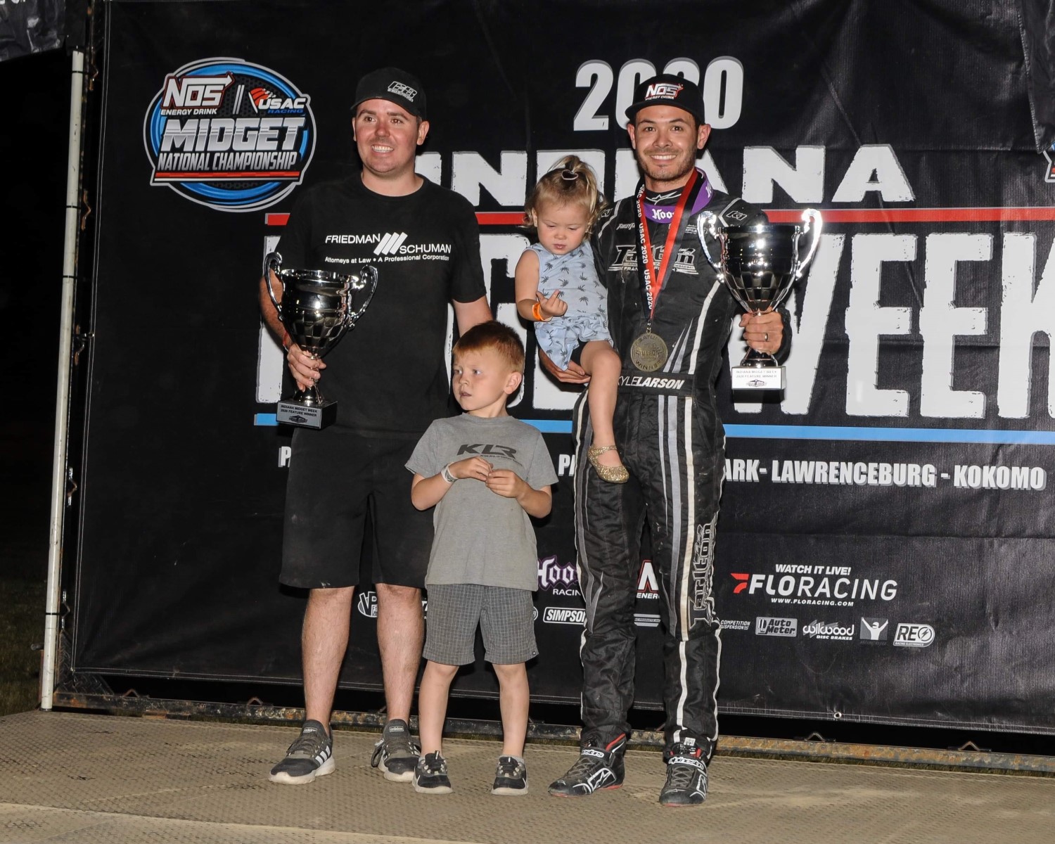 Larson celebrates with his 2 kids