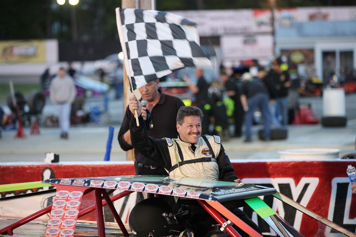 Shawn Balluzzo celebrates a Modifieds win at Langley Speedway at Langley Speedway in 2012