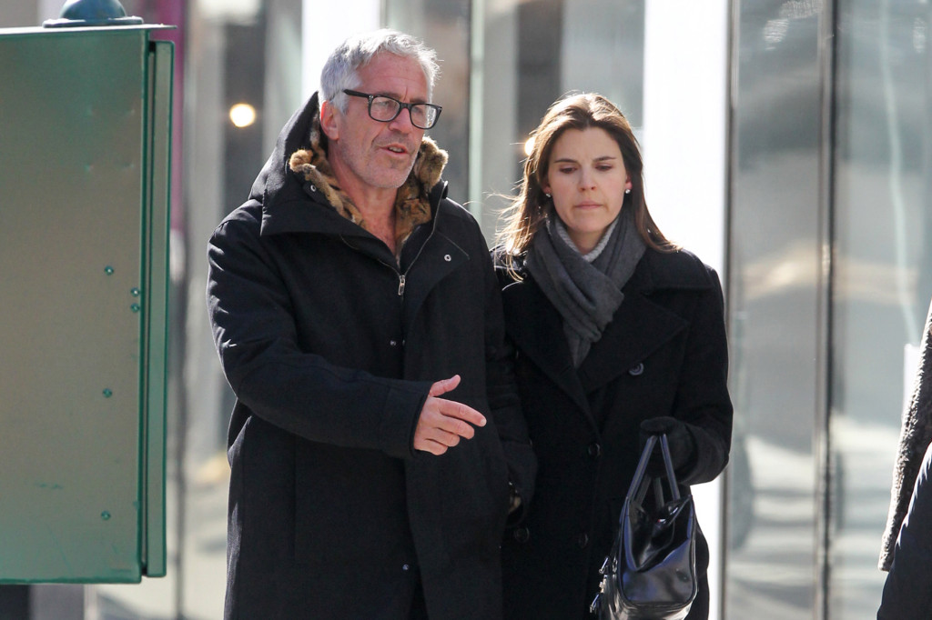 Jeffrey Epstein is seen walking with Sarah Kellen along Madison Avenue in NYC on January 30, 2012.