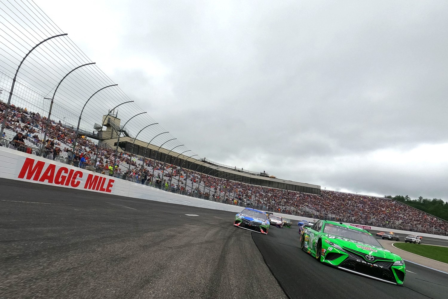 Kyle Busch, driver of the #18 Interstate Batteries Toyota, and Martin Truex Jr., driver of the #19 Resers Fine Foods #LetsPicnic Toyota, lead the field on a pace lap prior to the NASCAR Cup Series Foxwoods Resort Casino 301 at New Hampshire Motor Speedway on July 18, 2021 in Loudon, New Hampshire.