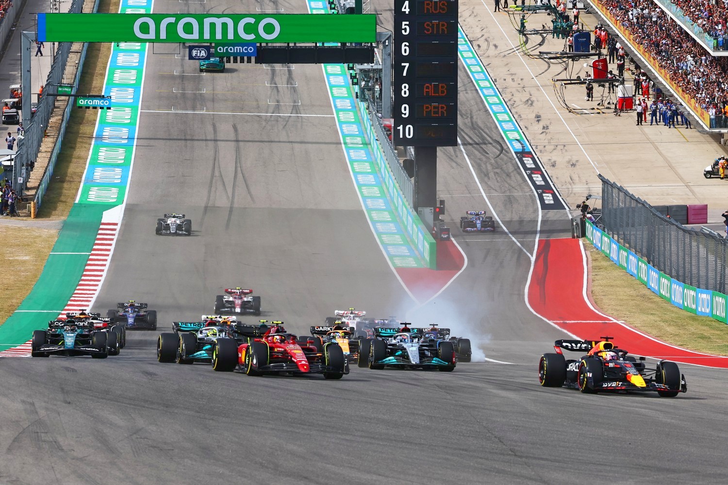 Max Verstappen of the Netherlands driving the (1) Oracle Red Bull Racing RB18 leads Carlos Sainz of Spain driving (55) the Ferrari F1-75 and the rest of the field at the start during the F1 Grand Prix of USA at Circuit of The Americas on October 23, 2022 in Austin, Texas. (Photo by Mark Thompson/Getty Images)