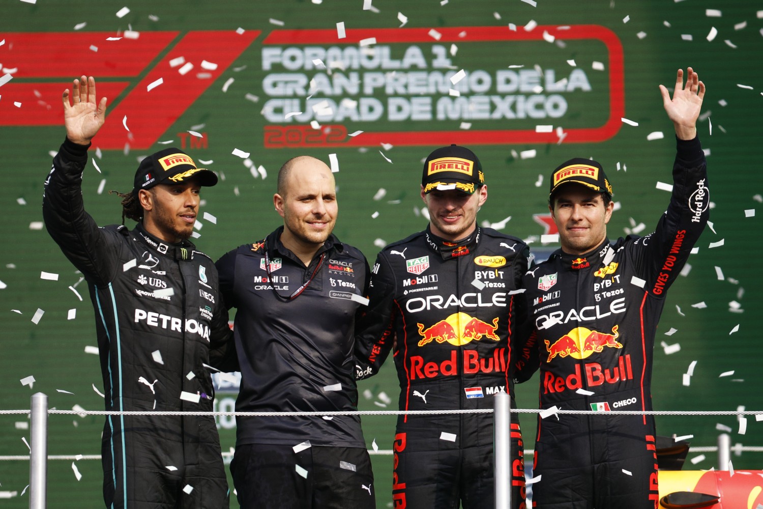 Race winner Max Verstappen of the Netherlands and Oracle Red Bull Racing, Second placed Lewis Hamilton of Great Britain and Mercedes, Third placed Sergio Perez of Mexico and Oracle Red Bull Racing and Red Bull Racing race engineer Gianpiero Lambiase celebrate on the podium during the F1 Grand Prix of Mexico at Autodromo Hermanos Rodriguez on October 30, 2022 in Mexico City, Mexico. (Photo by Jared C. Tilton/Getty Images)