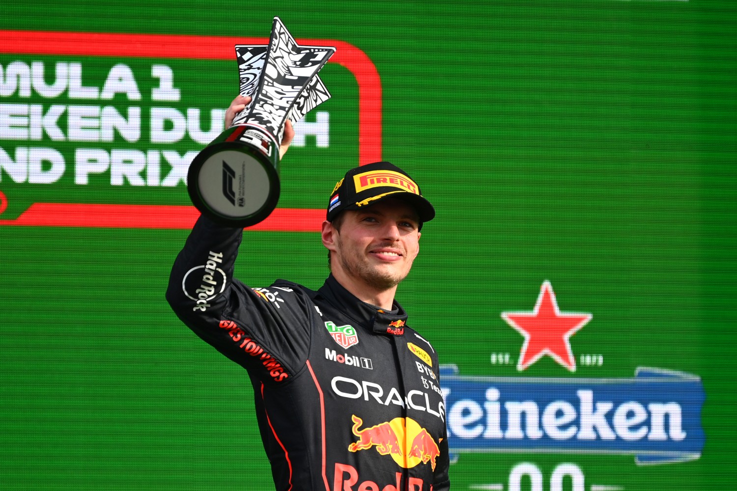 2022 Dutch GP Race winner Max Verstappen of the Netherlands and Oracle Red Bull Racing celebrates on the podium during the F1 Grand Prix of The Netherlands at Circuit Zandvoort on September 04, 2022 in Zandvoort, Netherlands. (Photo by Dan Mullan/Getty Images)
