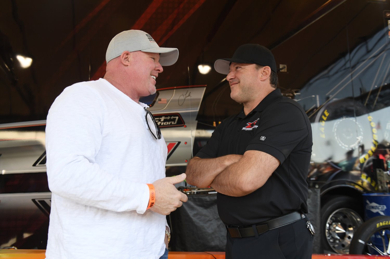 IndyCar veteran Paul Tracy and NHRA and NASCAR team owner Tony Stewart, enjoy a laugh. Photo by MARC GEWERTZ/NHRA