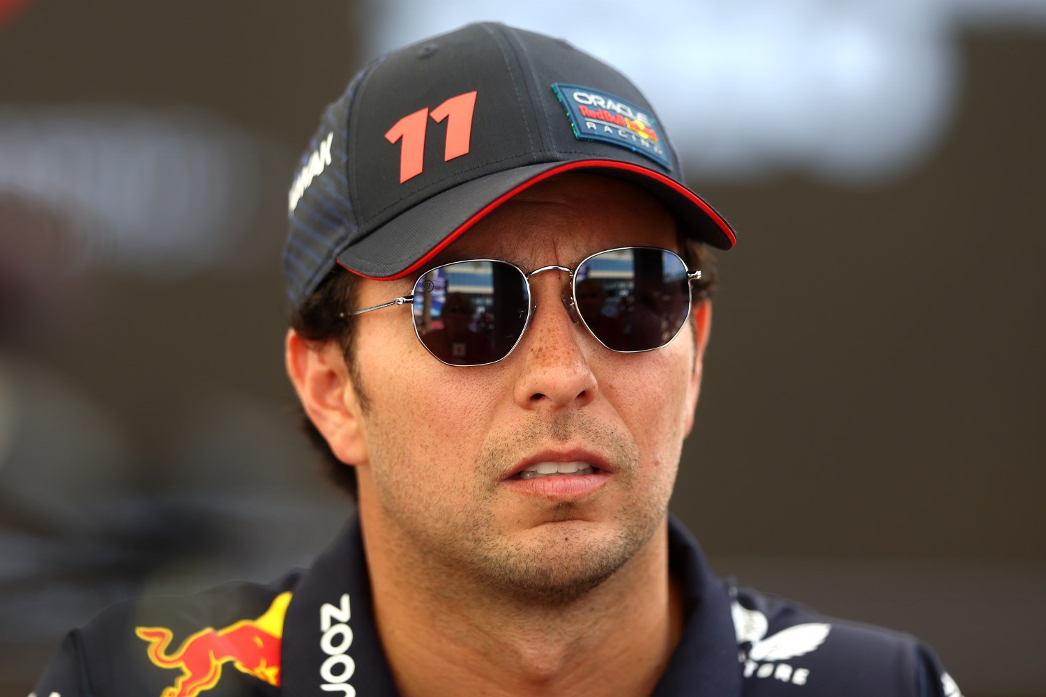 Sergio Perez of Mexico and Oracle Red Bull Racing looks on in the Paddock during previews ahead of the F1 Grand Prix of Abu Dhabi at Yas Marina Circuit on November 23, 2023 in Abu Dhabi, United Arab Emirates. (Photo by Clive Rose/Getty Images) // Getty Images / Red Bull Content Pool