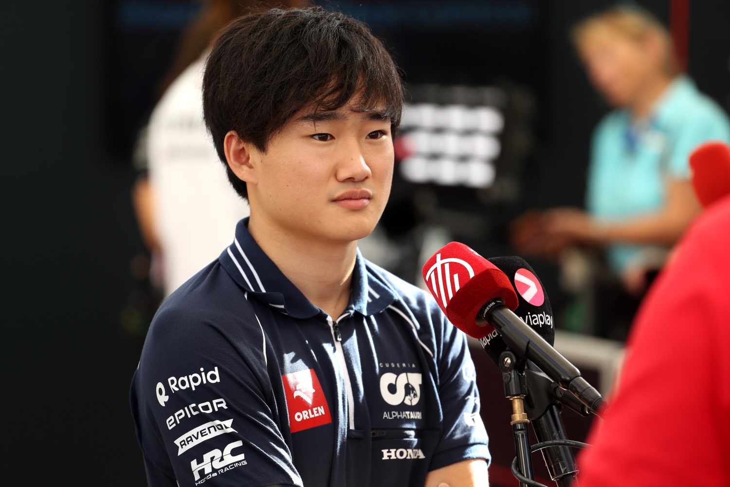 Yuki Tsunoda of Japan and Scuderia AlphaTauri talks to the media in the Paddock during previews ahead of the F1 Grand Prix of Abu Dhabi at Yas Marina Circuit on November 23, 2023 in Abu Dhabi, United Arab Emirates. (Photo by Peter Fox/Getty Images) // Getty Images / Red Bull Content Pool