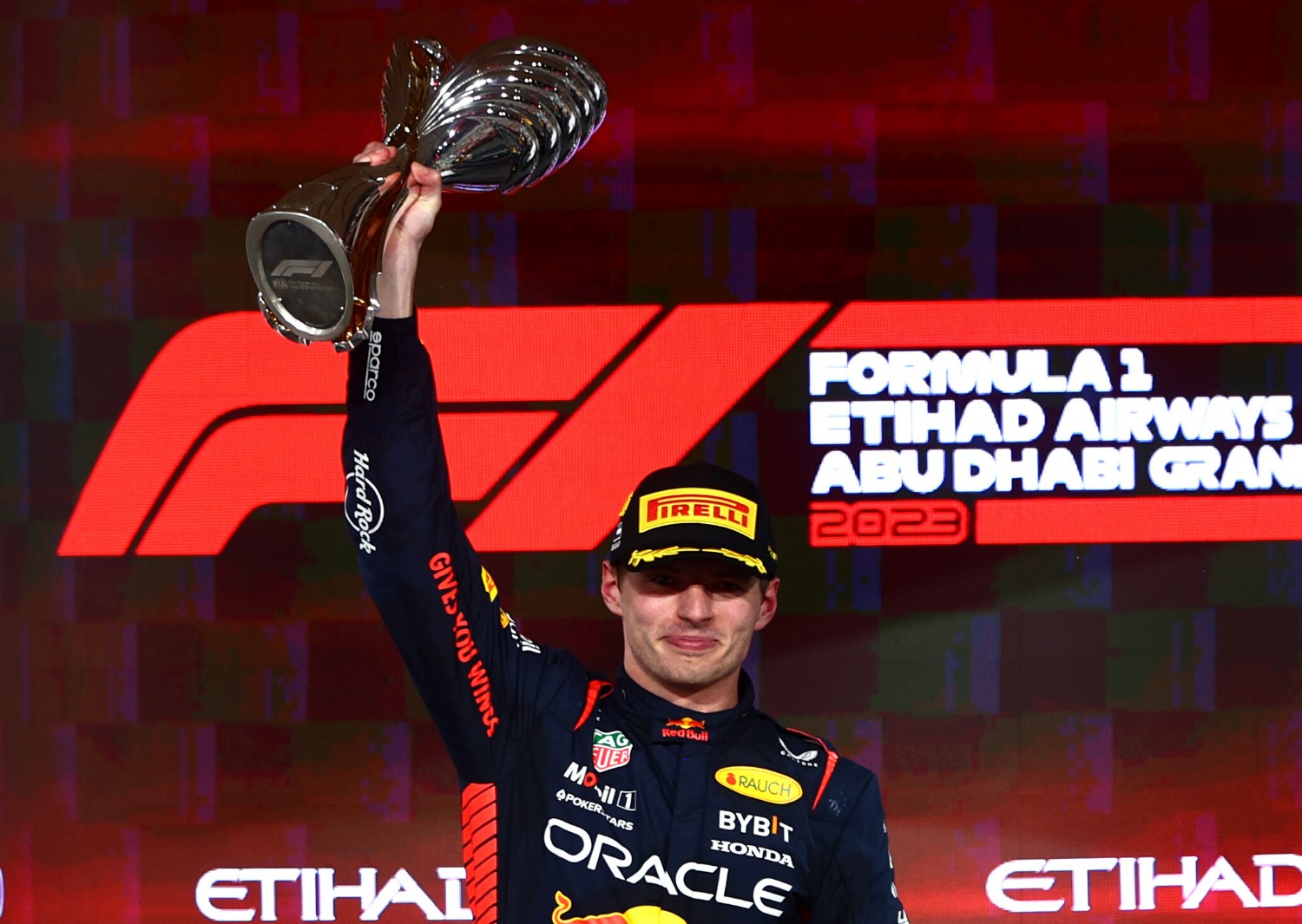Race winner Max Verstappen of the Netherlands and Oracle Red Bull Racing celebrates on the podium during the F1 Grand Prix of Abu Dhabi at Yas Marina Circuit on November 26, 2023 in Abu Dhabi, United Arab Emirates. (Photo by Clive Rose/Getty Images) // Getty Images / Red Bull Content Pool