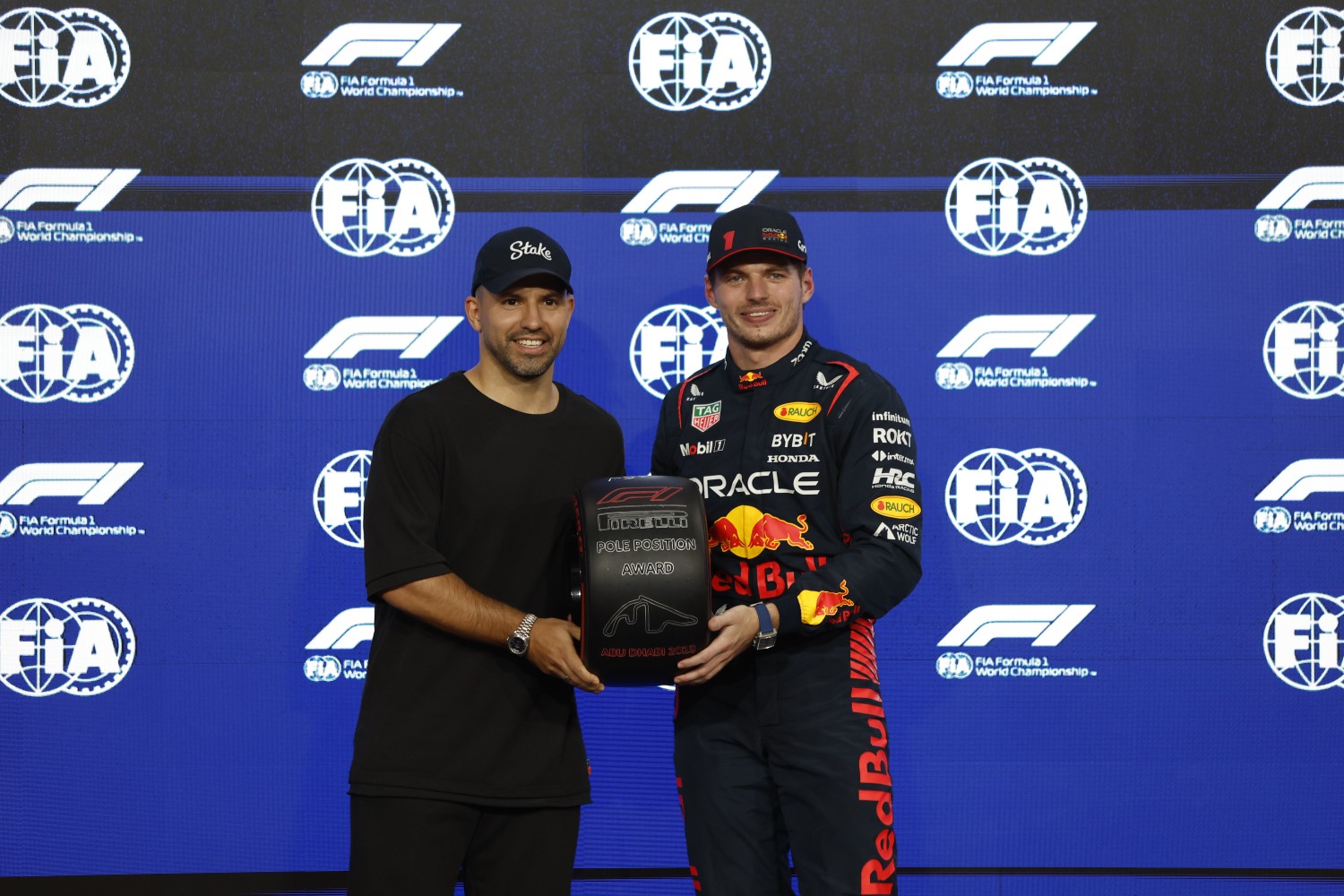 Former footballer Sergio Aguero presents Max Verstappen, Red Bull Racing, with his Pirelli Pole Position Award during the Abu Dhabi GP at Yas Marina Circuit on Saturday November 25, 2023 in Abu Dhabi, United Arab Emirates. (Photo by Steven Tee / LAT Images)