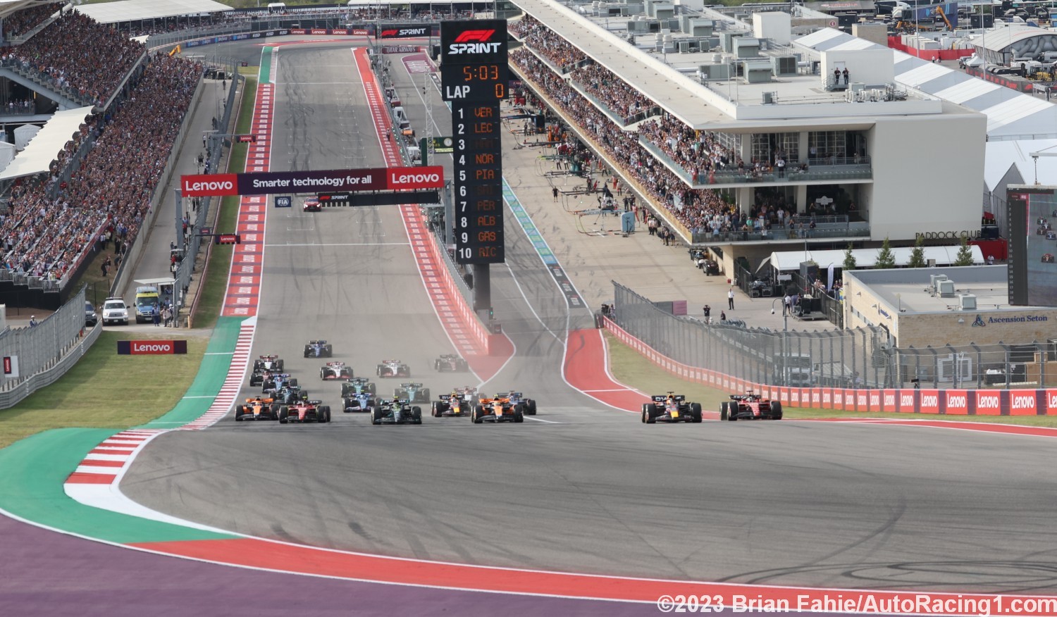 Max Verstappen squeezes Charles Leclerc down the inside into Turn 1 during the USGP Sprint Race
