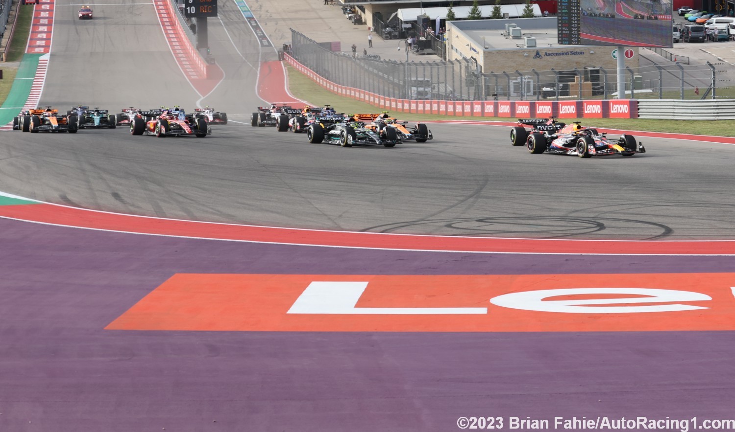 Max Verstappen duels with Charles Leclerc down the inside into Turn 1