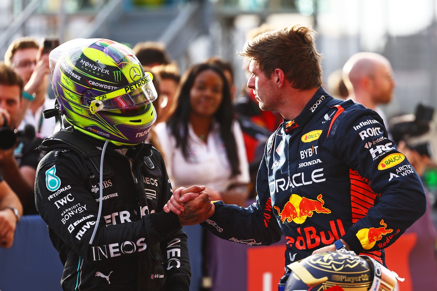 Sprint winner Max Verstappen of the Netherlands and Oracle Red Bull Racing shakes hands with Second placed Lewis Hamilton of Great Britain and Mercedes in parc ferme after the Sprint ahead of the F1 Grand Prix of United States at Circuit of The Americas on October 21, 2023 in Austin, Texas. (Photo by Mark Thompson/Getty Images)