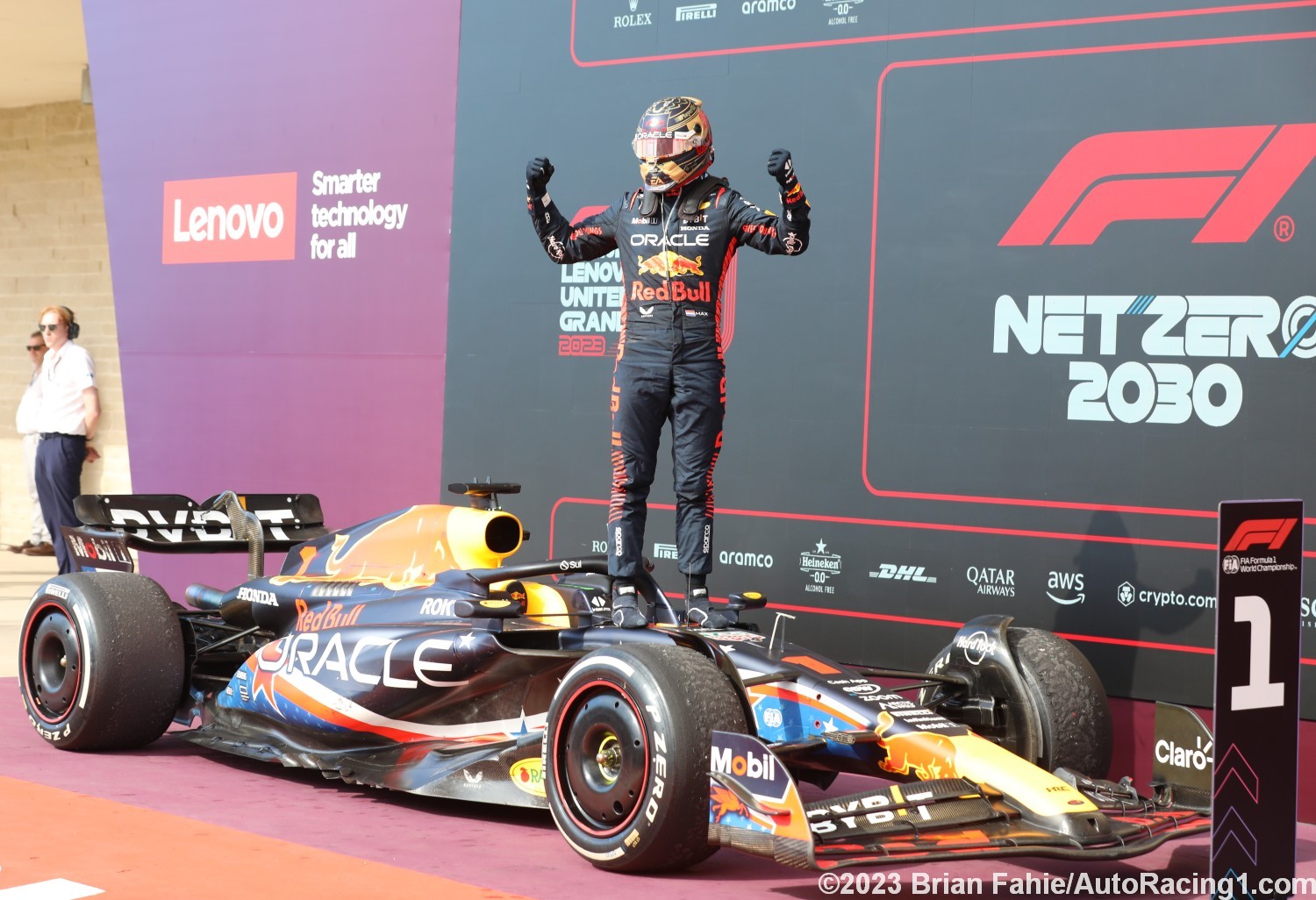 Max Verstappen celebrates on top of his car