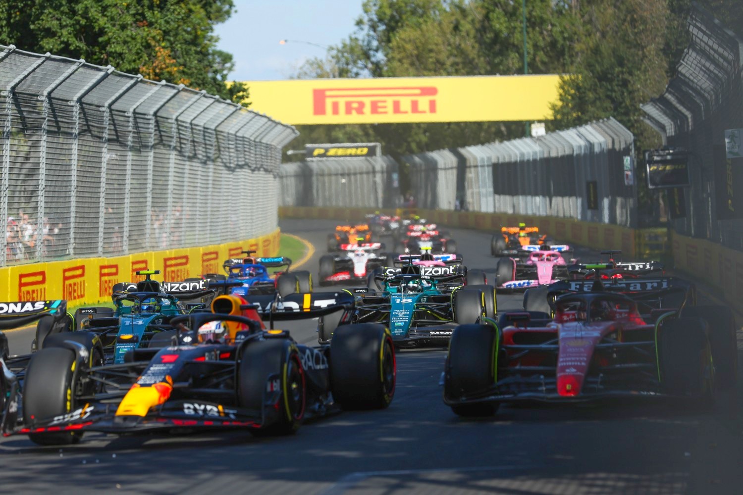 Max Verstappen, Red Bull Racing RB19, leads Carlos Sainz, Ferrari SF-23, Fernando Alonso, Aston Martin AMR23, Lance Stroll, Aston Martin AMR23, and the remainder of the field during the Australian GP at Melbourne Grand Prix Circuit on Sunday April 02, 2023 in Melbourne, Australia. (Photo by Lionel Ng / LAT Images)