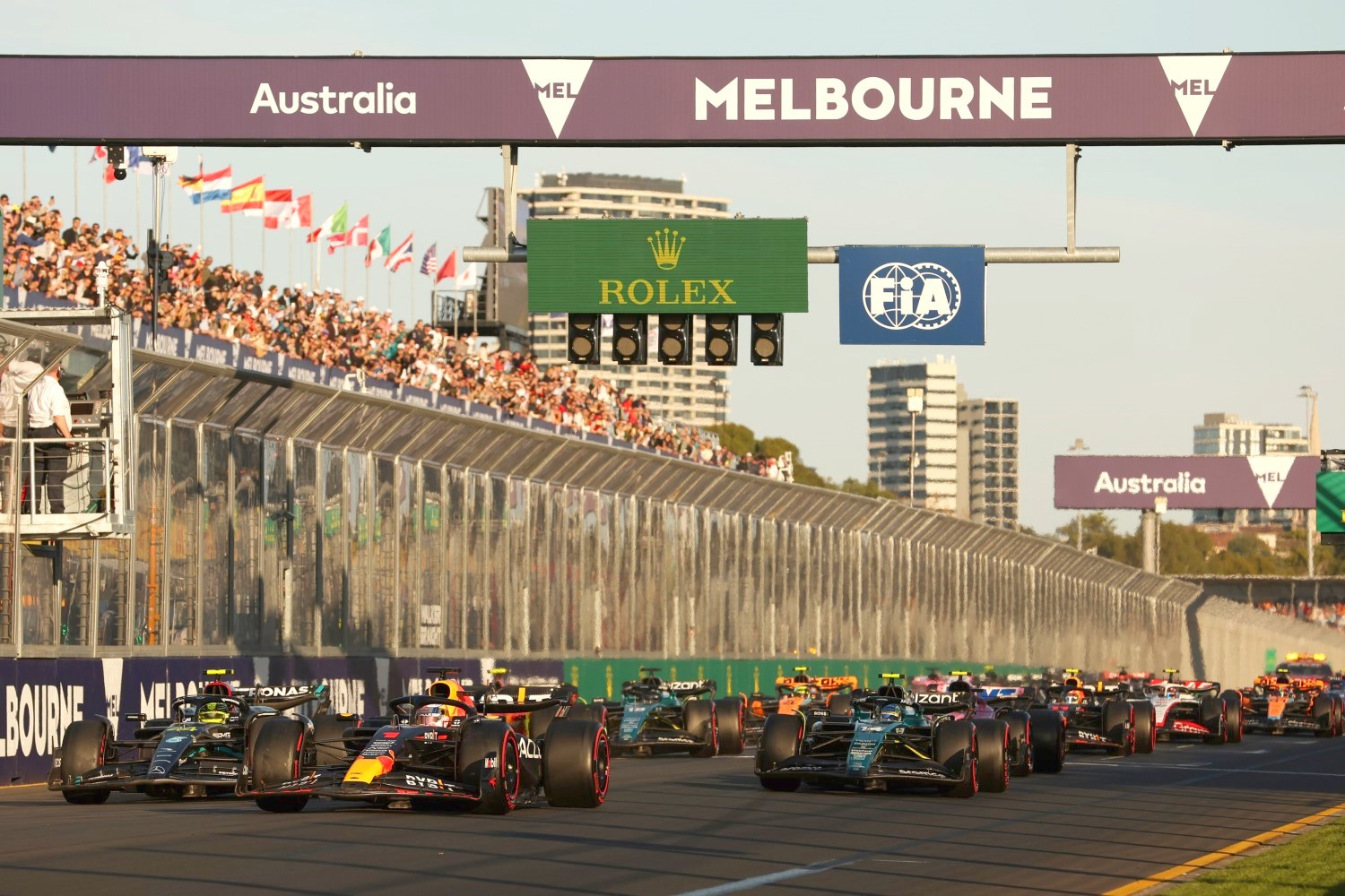 Race winner Max Verstappen of the Netherlands driving the (1) Oracle Red Bull Racing RB19 leads Second placed Lewis Hamilton of Great Britain driving the (44) Mercedes AMG Petronas F1 Team W14, Third placed Fernando Alonso of Spain driving the (14) Aston Martin AMR23 Mercedes and the rest of the field at the second restart during the F1 Grand Prix of Australia at Albert Park Grand Prix Circuit on April 02, 2023 in Melbourne, Australia. (Photo by Robert Cianflone/Getty Images) // Getty Images / Red Bull Content Pool