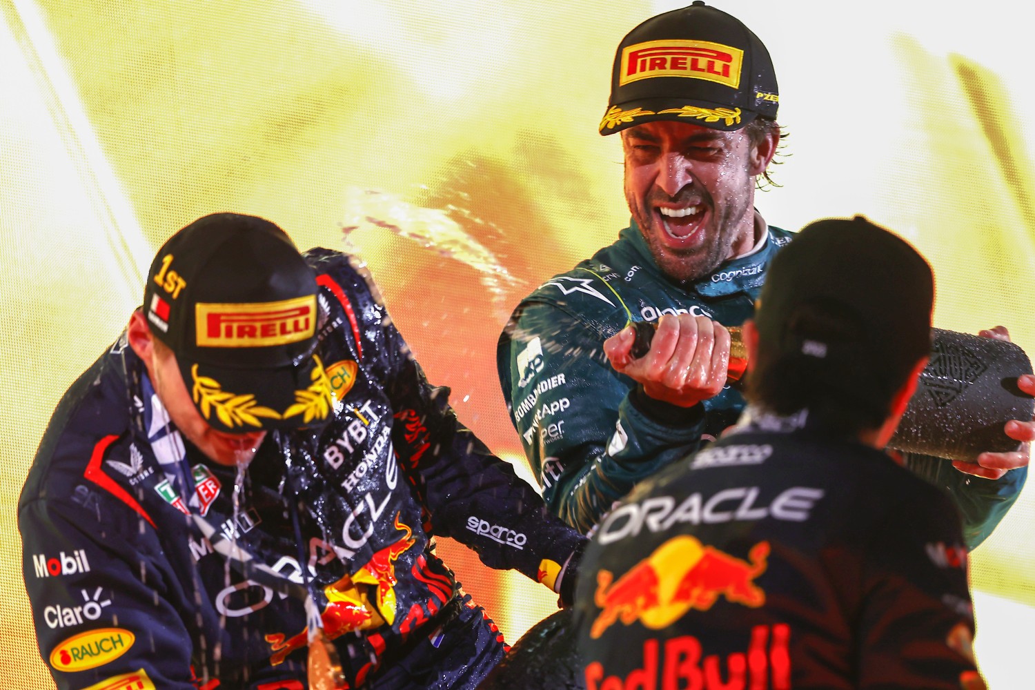 2023 Bahrain GP: Max Verstappen, Red Bull Racing, 1st position, Fernando Alonso, Aston Martin F1 Team, 3rd position, and Sergio Perez, Red Bull Racing, 2nd position, celebrate on the podium