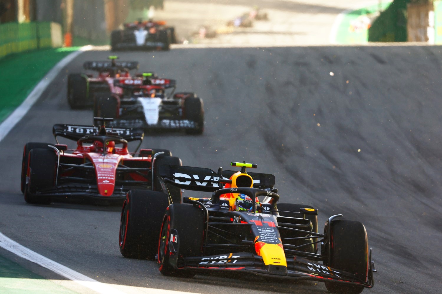 Sergio Perez of Mexico driving the (11) Oracle Red Bull Racing RB19 leads Charles Leclerc of Monaco driving the (16) Ferrari SF-23 on track during the Sprint ahead of the F1 Grand Prix of Brazil at Autodromo Jose Carlos Pace on November 04, 2023 in Sao Paulo, Brazil. (Photo by Mark Thompson/Getty Images) // Getty Images / Red Bull Content Pool