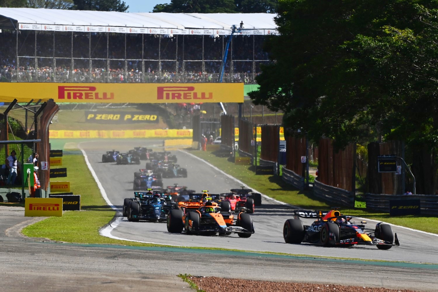 Max Verstappen, Red Bull Racing RB19, leads Lando Norris, McLaren MCL60, George Russell, Mercedes F1 W14, and the rest of the field during the Brazilian GP at Autódromo José Carlos Pace on Saturday November 04, 2023 in Sao Paulo, Brazil. (Photo by Mark Sutton / LAT Images)