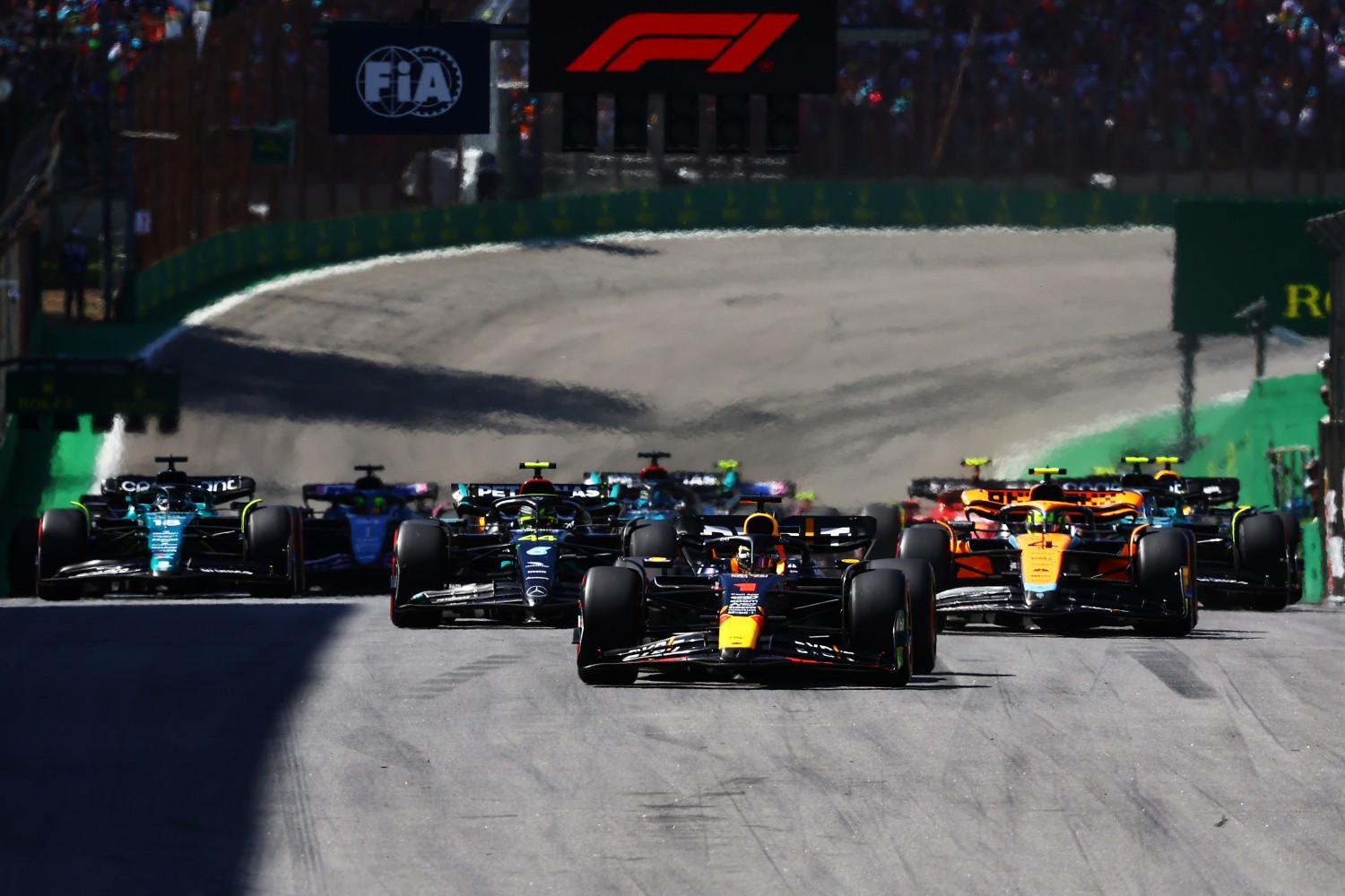 Max Verstappen of the Netherlands driving the (1) Oracle Red Bull Racing RB19 leads Lewis Hamilton of Great Britain driving the (44) Mercedes AMG Petronas F1 Team W14 and Lando Norris of Great Britain driving the (4) McLaren MCL60 Mercedes at the restart after a red flag delay during the F1 Grand Prix of Brazil at Autodromo Jose Carlos Pace on November 05, 2023 in Sao Paulo, Brazil. (Photo by Mark Thompson/Getty Images)