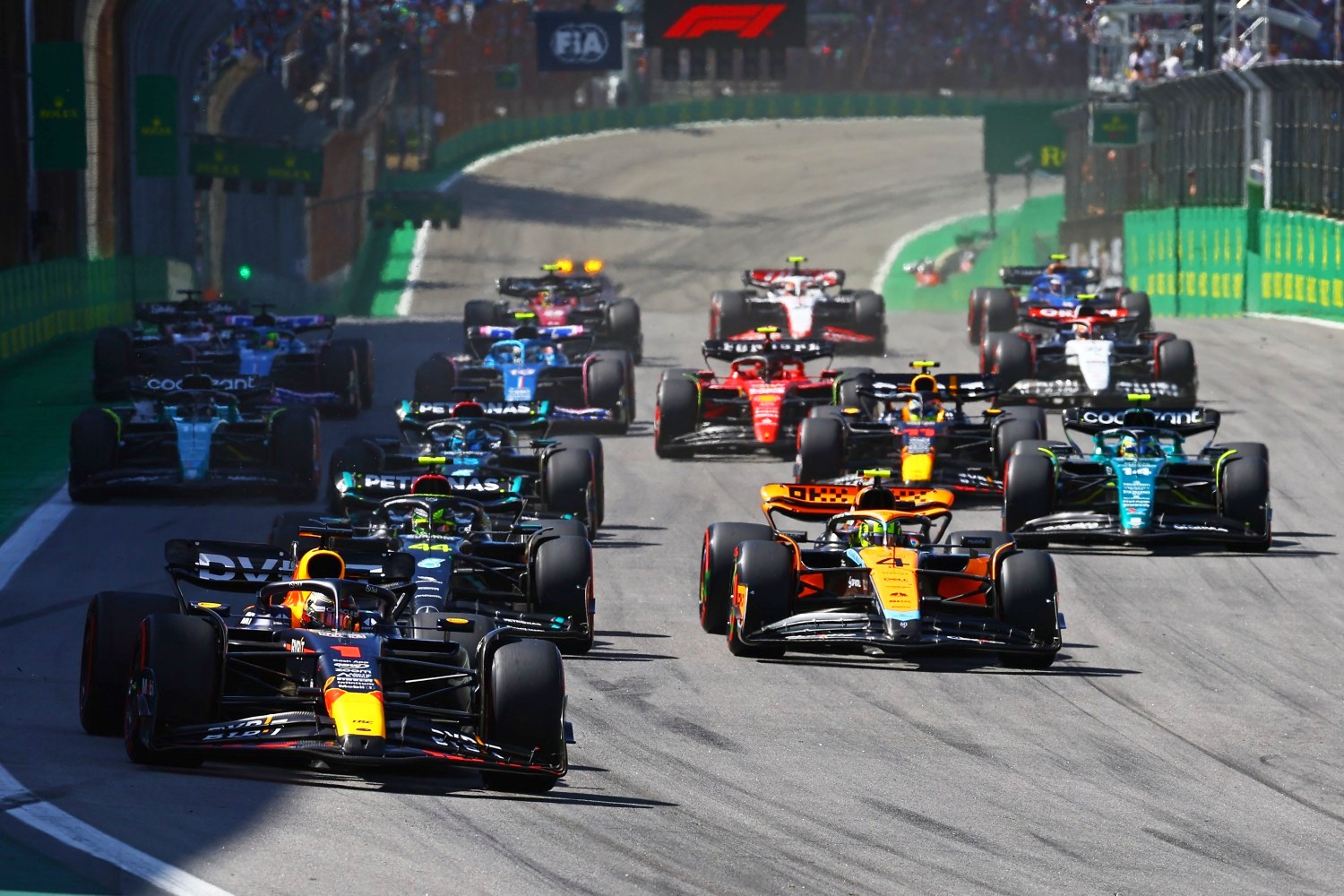 Max Verstappen of the Netherlands driving the (1) Oracle Red Bull Racing RB19 leads Lewis Hamilton of Great Britain driving the (44) Mercedes AMG Petronas F1 Team W14 and Lando Norris of Great Britain driving the (4) McLaren MCL60 Mercedes at the restart after a red flag delay during the F1 Grand Prix of Brazil at Autodromo Jose Carlos Pace on November 05, 2023 in Sao Paulo, Brazil. (Photo by Mark Thompson/Getty Images)
