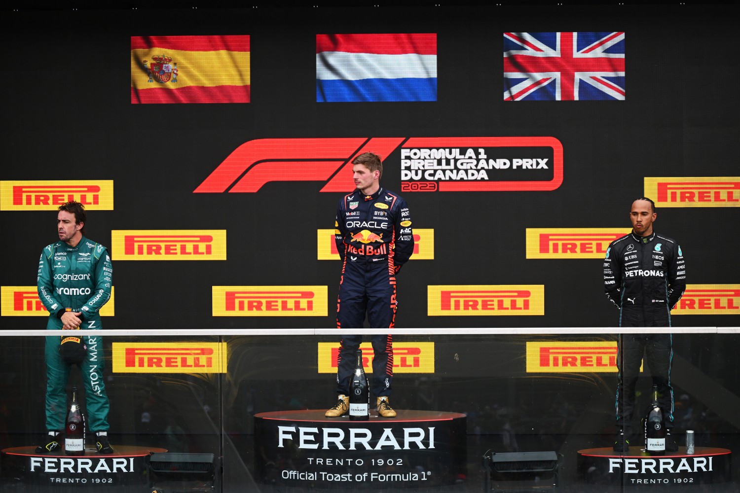 MONTREAL, QUEBEC - JUNE 18: (L-R) Second placed Fernando Alonso of Spain and Aston Martin F1 Team, First placed Max Verstappen of the Netherlands and Oracle Red Bull Racing and Third placed Lewis Hamilton of Great Britain and Mercedes celebrate on the podium during the F1 Grand Prix of Canada at Circuit Gilles Villeneuve on June 18, 2023 in Montreal, Quebec. (Photo by Clive Mason/Getty Images) // Getty Images / Red Bull Content Pool 