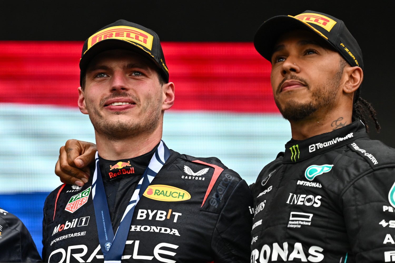 Race winner Max Verstappen of the Netherlands and Oracle Red Bull Racing and Third placed Lewis Hamilton of Great Britain and Mercedes celebrate on the podium during the F1 Grand Prix of Canada at Circuit Gilles Villeneuve on June 18, 2023 in Montreal, Quebec. (Photo by Minas Panagiotakis/Getty Images) // Getty Images / Red Bull Content Pool