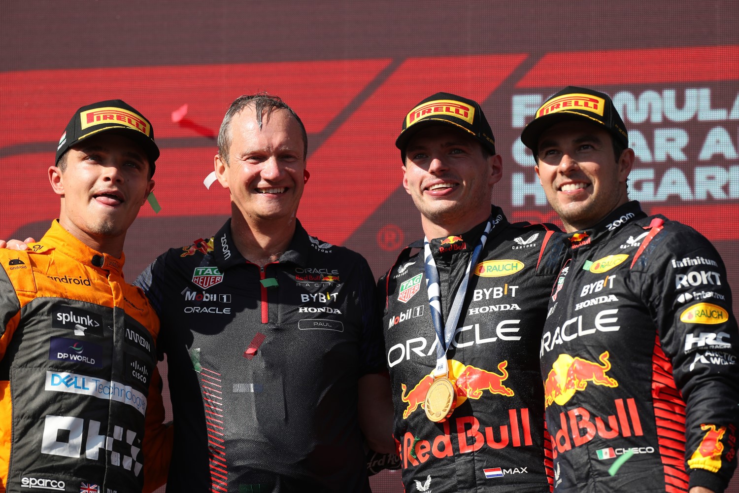 Race winner Max Verstappen of the Netherlands and Oracle Red Bull Racing, Second placed Lando Norris of Great Britain and McLaren, Third placed Sergio Perez of Mexico and Oracle Red Bull Racing and Red Bull Racing Head of Car Engineering Paul Monaghan celebrate on the podium during the F1 Grand Prix of Hungary at Hungaroring on July 23, 2023 in Budapest, Hungary. (Photo by Peter Fox/Getty Images) // Getty Images / Red Bull Content Pool