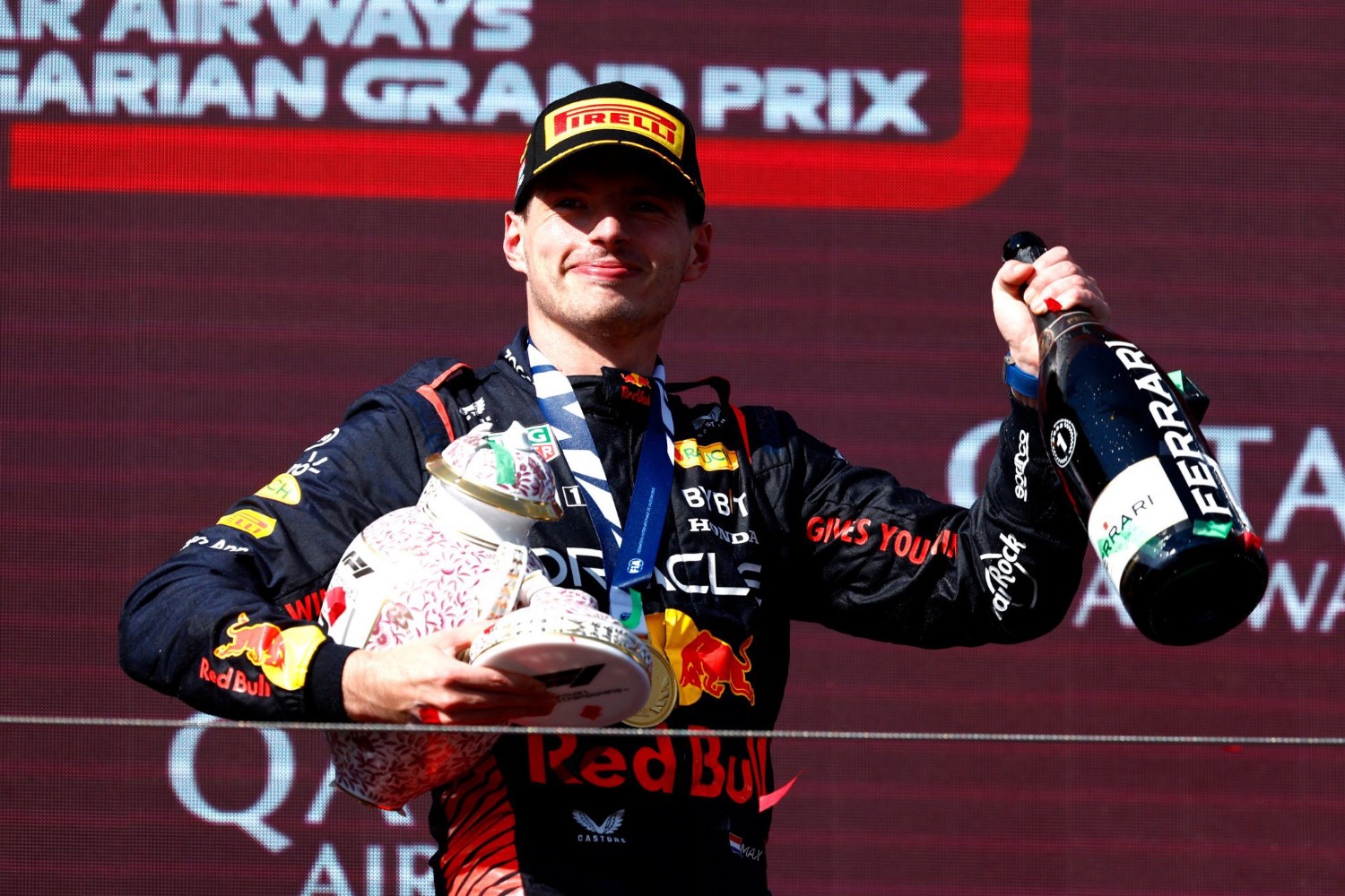 Max Verstappen walks off the Hungarian GP podium with his broken trophy. Verstappen will get Norris back by beating him like a drum on race days