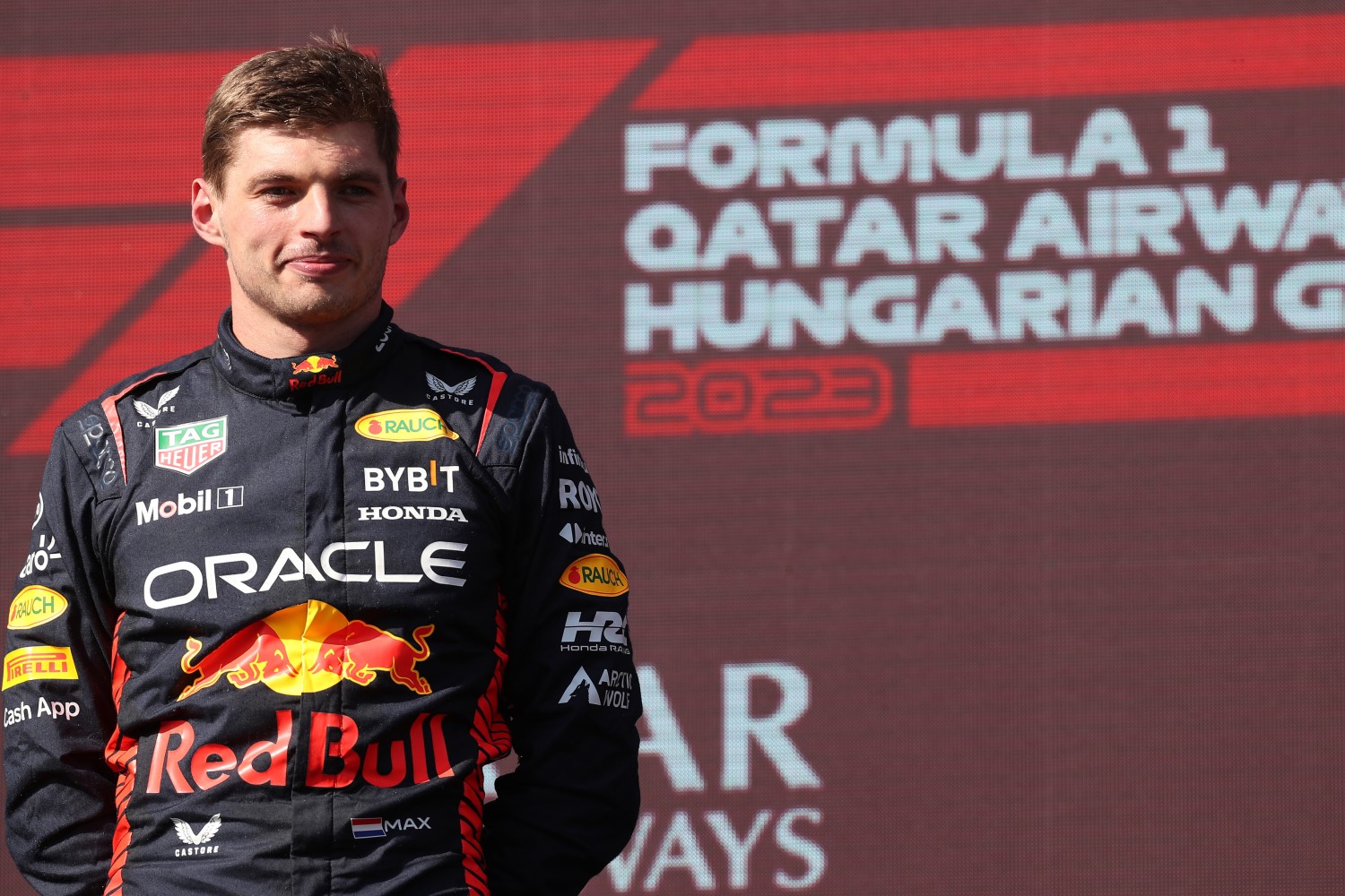 Race winner Max Verstappen of the Netherlands and Oracle Red Bull Racing celebrates on the podium during the F1 Grand Prix of Hungary at Hungaroring on July 23, 2023 in Budapest, Hungary. (Photo by Peter Fox/Getty Images) // Getty Images / Red Bull Content Pool