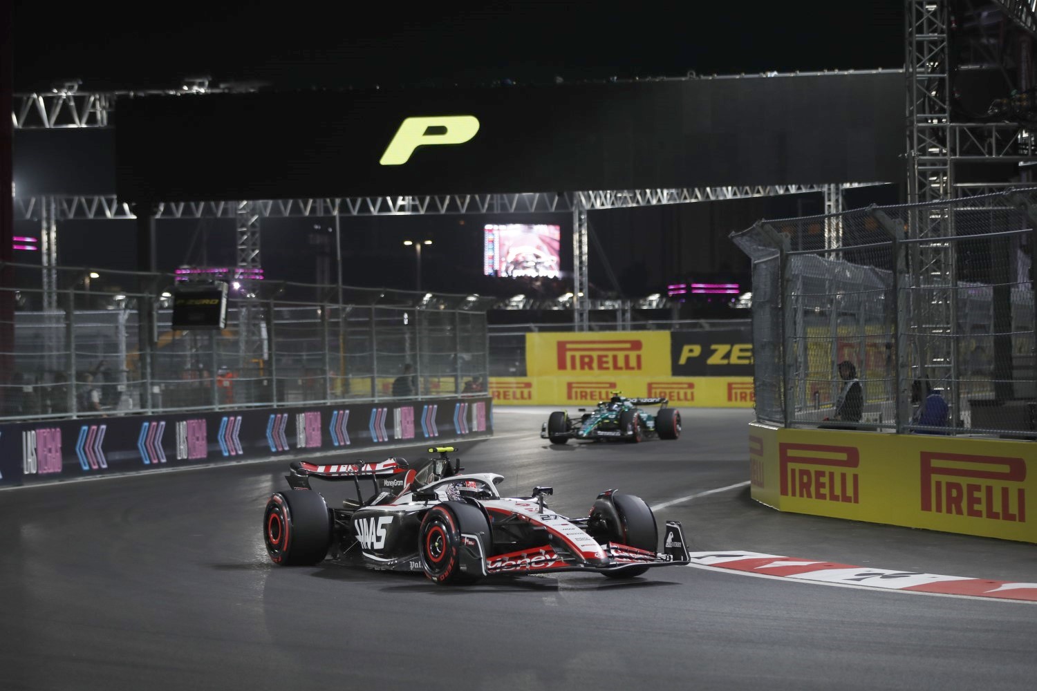 Nico Hulkenberg, Haas VF-23, leads Fernando Alonso, Aston Martin AMR23 during the Las Vegas GP at Streets of Las Vegas on Friday November 17, 2023, United States of America. (Photo by Jake Grant / LAT Images)